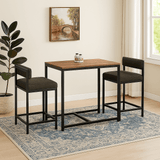 Wood and Metal 2 seater dining table with two chairs in a cozy room setting.
