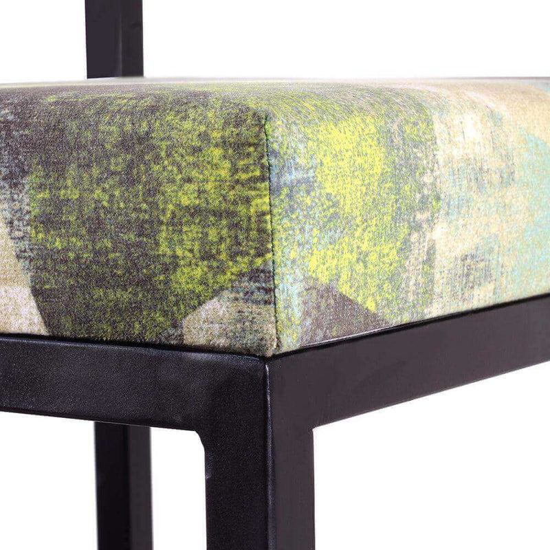 Close-up view of the multicolor fabric seat on a modern Multicolor Metal Chair set of 2 with a sleek black frame.